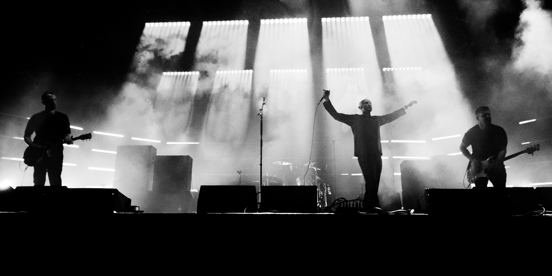 The Music performing live on stage at Temple Newsam, Leeds — dramatic stage lighting, black and white